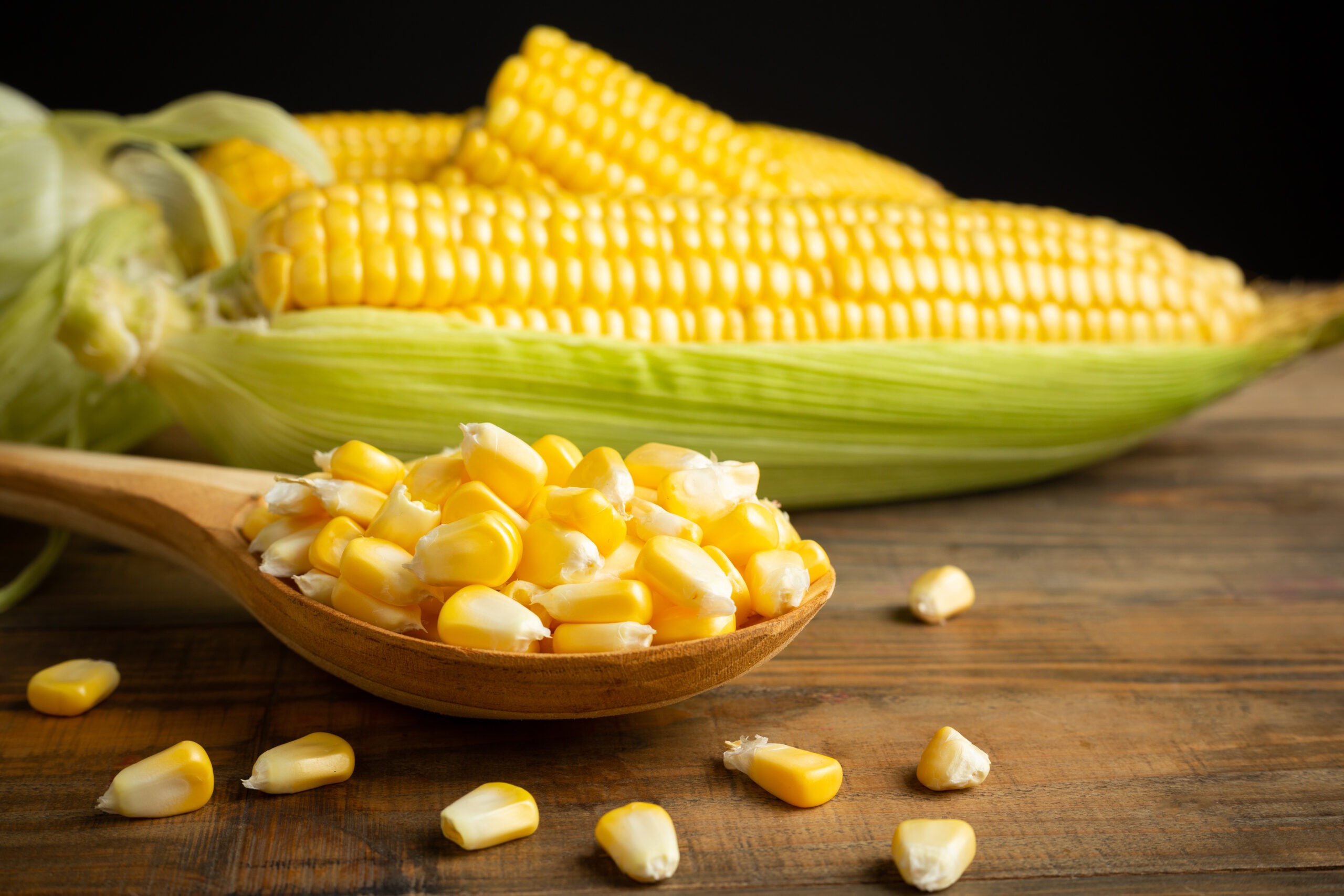 seeds-and-sweet-corn-on-wooden-table
